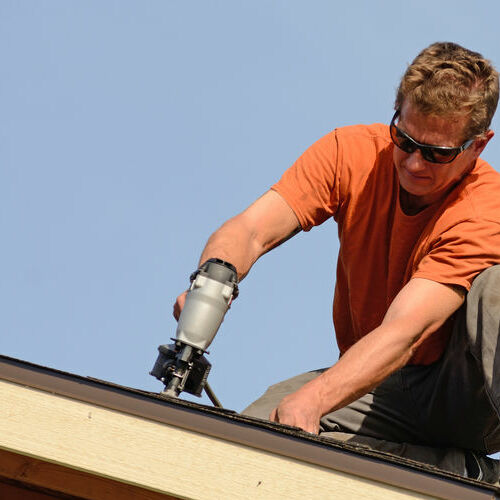 A Roofer Working on a Roof.